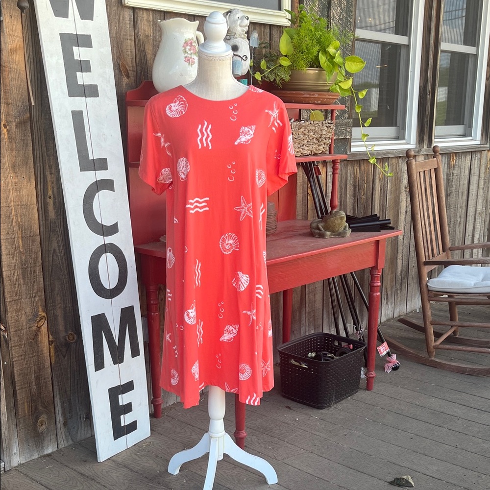 Links Large slip on cover up dress. Orange beach print.